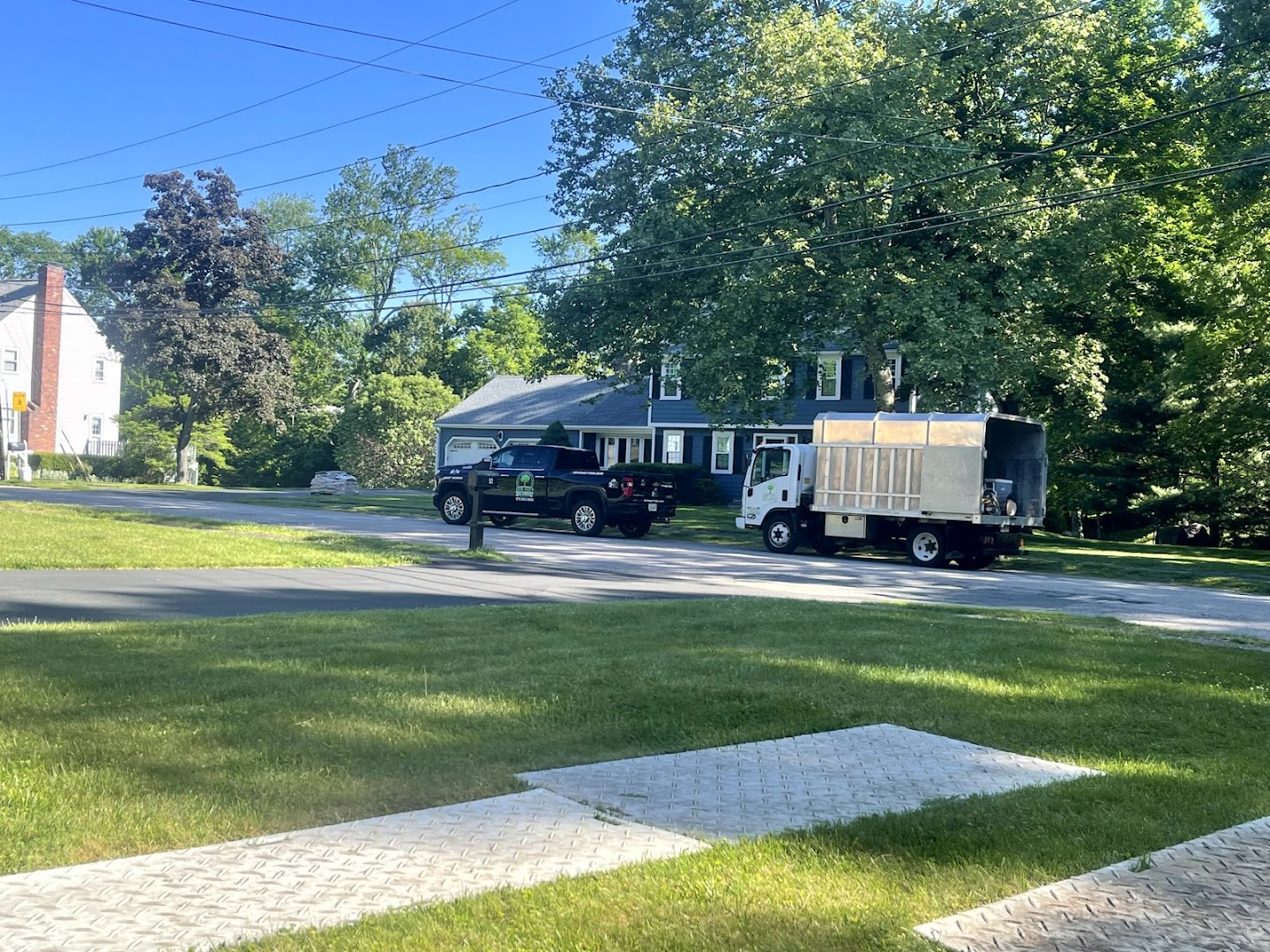 Finished property with paver walkway and lawn, North Shore MA